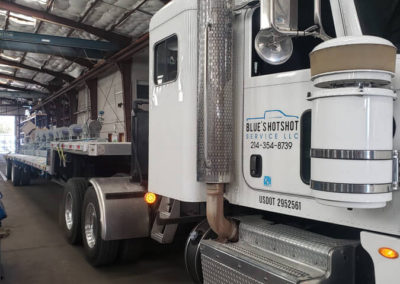 Blue's Hotshot semi truck being loaded for a haul.